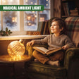 A child sits in a green armchair reading a book next to a 20cm amber glass bauble with warm white LED lights on a side table