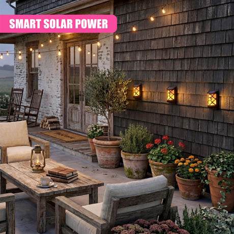 Wall-mounted LED outdoor lights illuminate the dark wooden siding near the home's entryway.