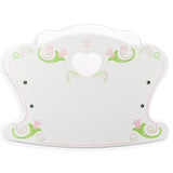 Light-colored decorative plaque with pink and green scrollwork, designed as a cradle for dolls.