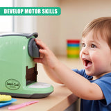 A child's hands grasp a toy, a small, green, toy kitchen appliance with a rotating dial, a "Smart Cook" logo, and a "Smart Cook" label on the front. - UKBuyZone