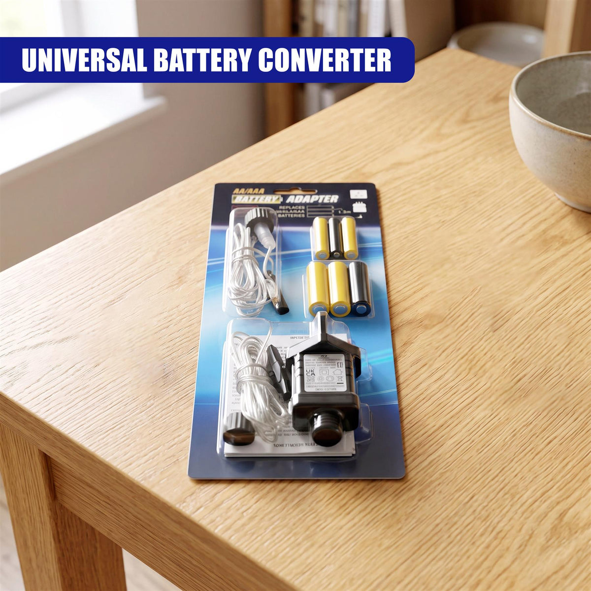 A packaged battery eliminator kit sits on a wooden table