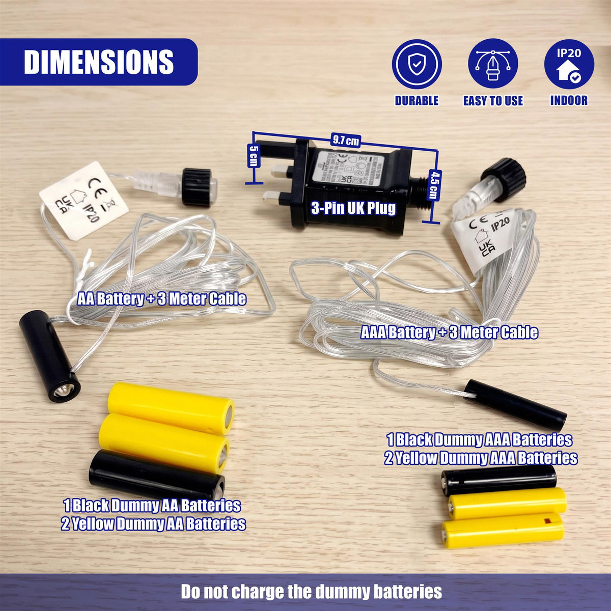 Geezy battery eliminator kit with UK plug, cables and dummy AA and AAA batteries on a wooden surface