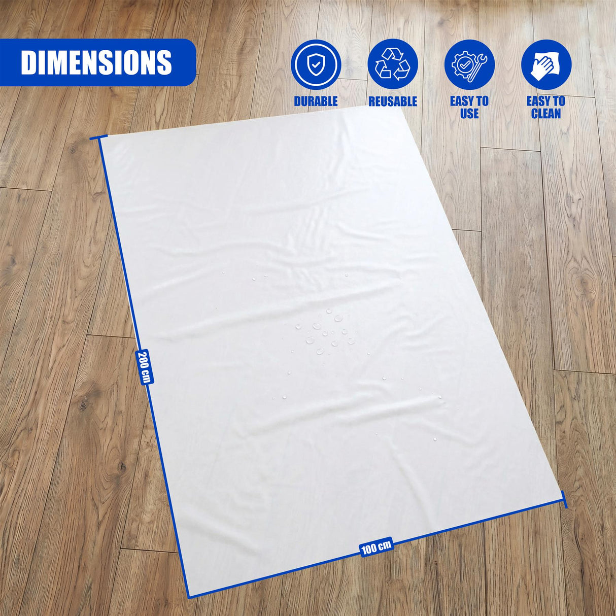 A white rectangular sheet laid on a wood floor, measuring 200 cm by 100 cm.