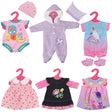 1. Pink dress with flowers and a matching jacket

2. Blue striped jumpsuit with white hoodie

3. Purple onesie with pink polka dots

4. Gray zip-up outfit with white trim and pockets

5. Black and white zigzag sweater with pink collar

6. White jumper with a white collar and blue stripe detailing - UKBuyZone