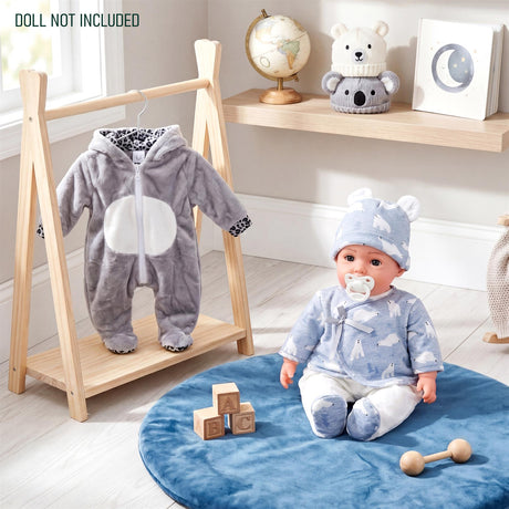 Gray koala jumpsuit and blue patterned outfit displayed on a wooden doll mannequin stand.