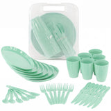The set includes stacked plates, cups, spoons, forks, knives, and a clear storage caddy.