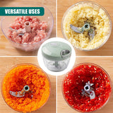 The chopper processes various foods, including meat, cheese, carrots, and tomato mixture.