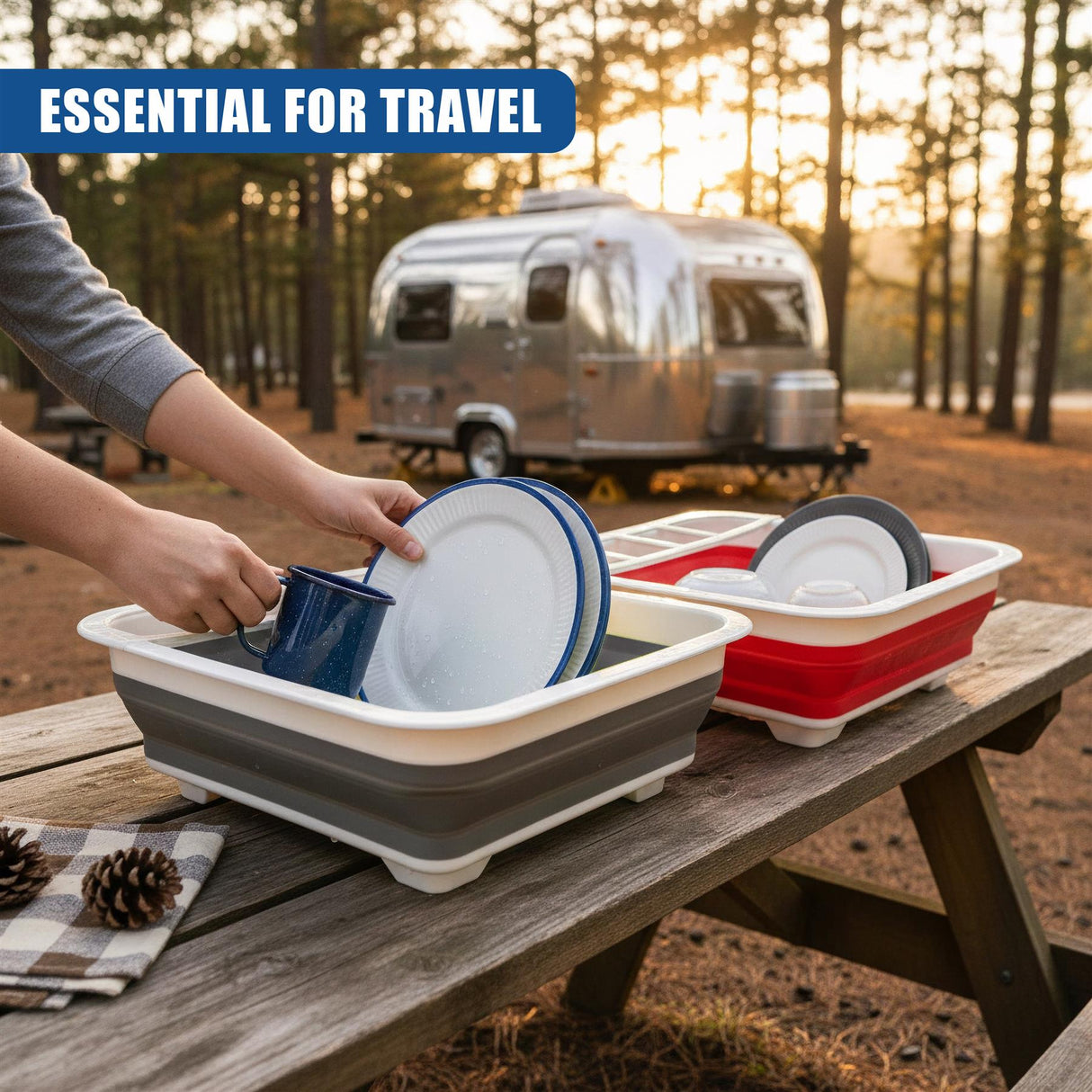 A person places dishes into two collapsible dish drainers set on a wooden picnic table.