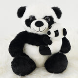 A cute, super soft plush toy featuring a large panda holding a smaller panda. The plush has black and white fur, with a friendly smile and bright eyes, making it an ideal gift for children. Perfect for cuddling and playtime. Available at ukbuyzone.