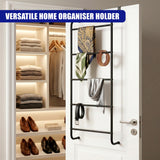 Vertical black metal towel organizer rail attached to a white door, holding various accessories and towels.