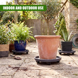 Terracotta pot placed on a dark, wheeled round caddy resting on stone pavers.