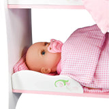 "Baby doll resting in a pink baby crib." - UKBuyZone