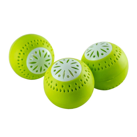 Set of three neon green deodorant balls with decorative cutouts for refrigerator use.
