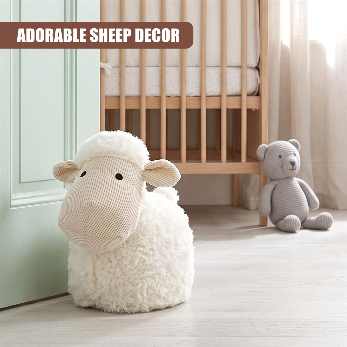 Fluffy white stuffed sheep novelty door stopper resting by a crib and teddy bear.