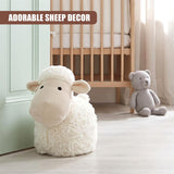 Fluffy white stuffed sheep novelty door stopper resting by a crib and teddy bear.