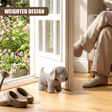 Knitted grey dog stopper rests on a wooden floor near a window with visible flowers.