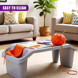 "Two-tone grey ottoman with storage space, knitting supplies on top and yarn hanging off side. A comfortable and functional piece of furniture." - UKBuyZone