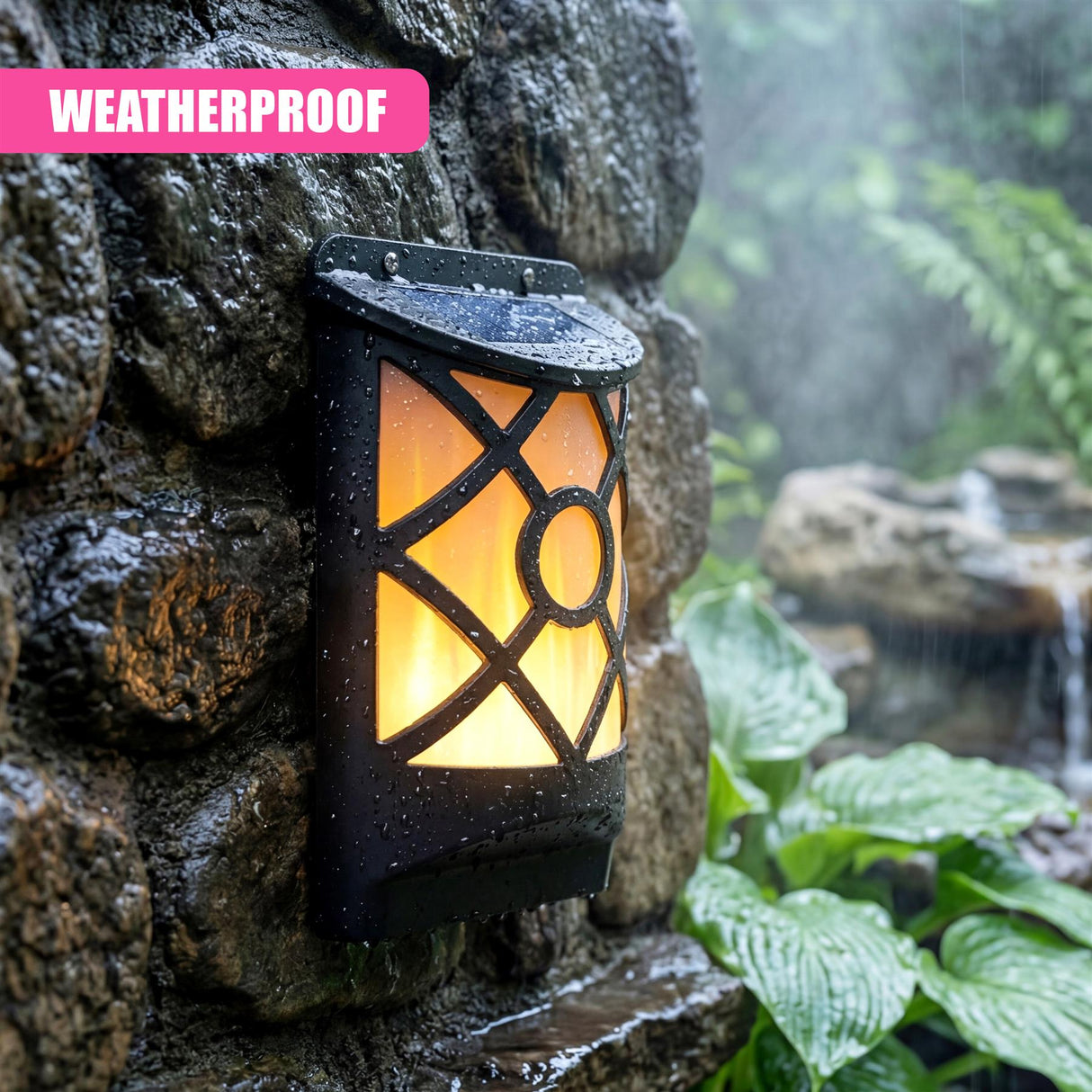 Black lantern light mounted on a stone wall, illuminated next to green foliage and running water.