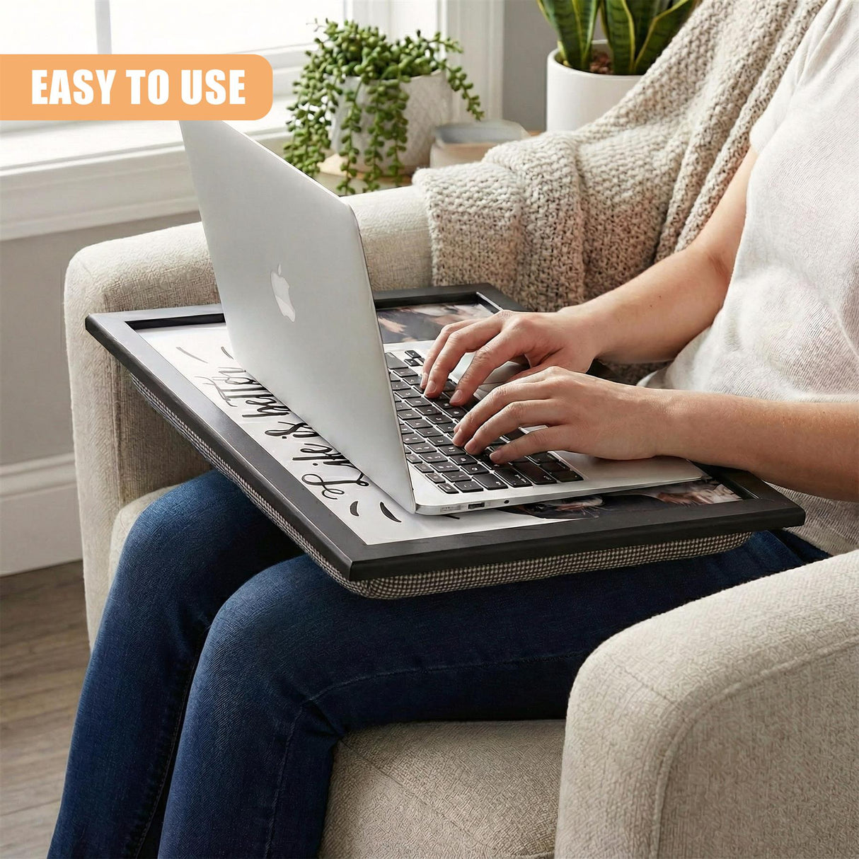 A person sitting on a couch, holding a tray with a laptop on it, using it as a laptop desk. - UKBuyZone