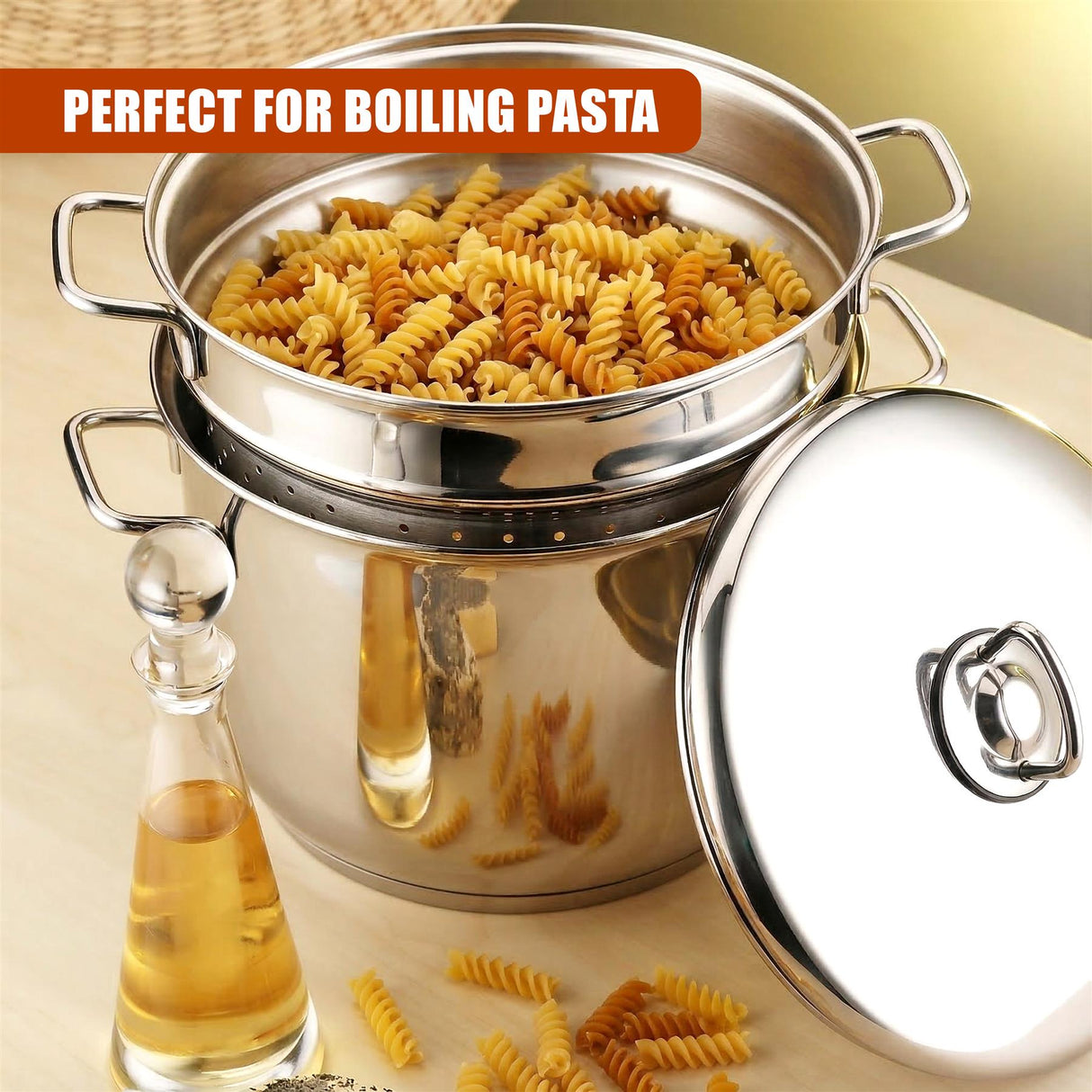 Stainless steel pasta pot set filled with pasta, displayed alongside an oil carafe and matching lid.