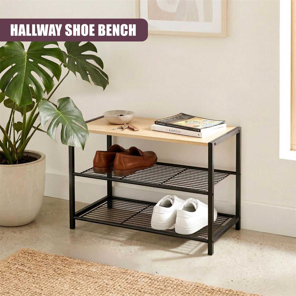 A black, two-tiered shoe bench holding shoes, books, and a bowl on the top surface.