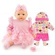 Pink doll in a ruffled dress, displayed with matching donut-patterned clothes and accessories.