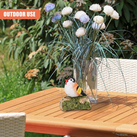 Decorative bird on outdoor table with flowers - UKBuyZone