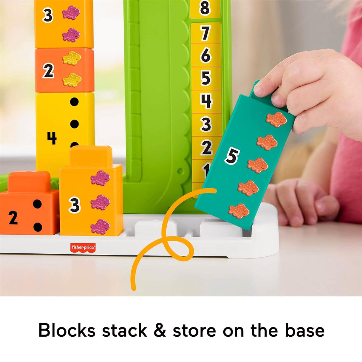 A child stacks numbered blocks and uses the alligator piece on the counting toy.