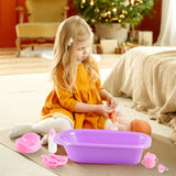 A young girl is playing with a purple baby doll set on the floor.