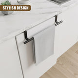 Black metal towel bar mounted on white cabinet. A folded, textured gray towel hangs from the bar.
