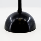 A black dome-shaped light fixture.